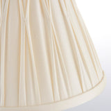 Close-up of the Bevdon 20cm tapered lamp shade in ivory silk with box pleat design and hand-stitched pinch pleats, shown on a plain white background.