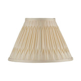 Endon Bevdon 25cm tapered lamp shade in ivory silk with hand-stitched double pinch pleats and taped edges, shown on a plain white background.