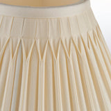 Close-up of Endon Bevdon 25cm tapered lamp shade in ivory silk, showing box pleats and hand-stitched double pinch pleat detail.