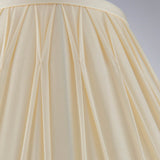 Close-up of Endon Bevdon 30cm tapered lamp shade in ivory silk, showing hand-stitched pinch pleats and box pleat detail against a plain background.