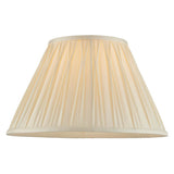 Bevdon 35cm tapered lamp shade in ivory silk with pinch-pleat detailing and taped edges, shown on a plain white background.