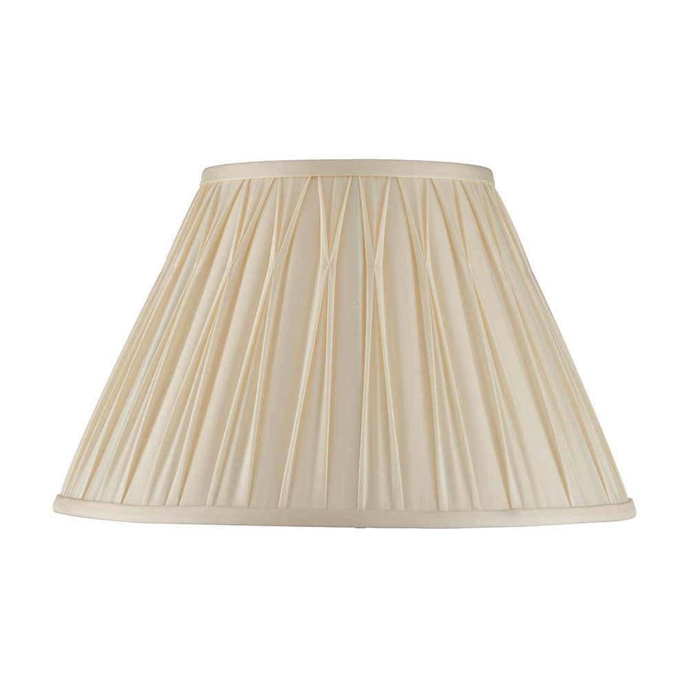 Bevdon 35cm tapered lamp shade in ivory silk with hand-stitched pinch pleats and taped edges, shown on a plain white background.
