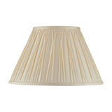 Bevdon 35cm tapered lamp shade in ivory silk with hand-stitched pinch pleats and taped edges, shown on a plain white background.