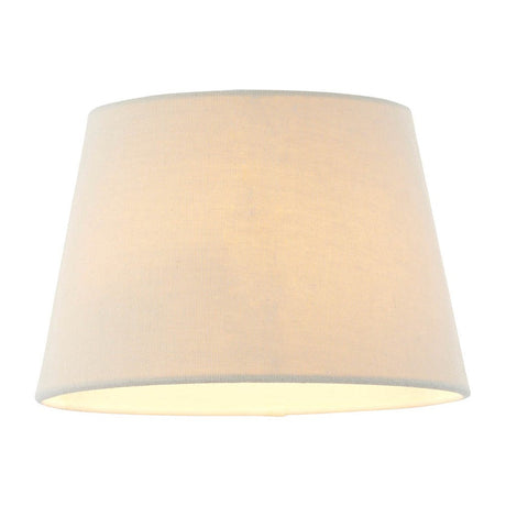 Endon Bevhurst 20cm tapered lamp shade in cream linen-effect fabric with a rolled edge, shown illuminated against a plain white background.