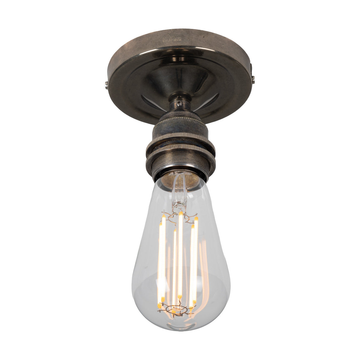 Bexter Vintage Brass Flush Ceiling Light with round ceiling plate and single knurled E27 lampholder holding a bare filament bulb, shown against a plain white background.