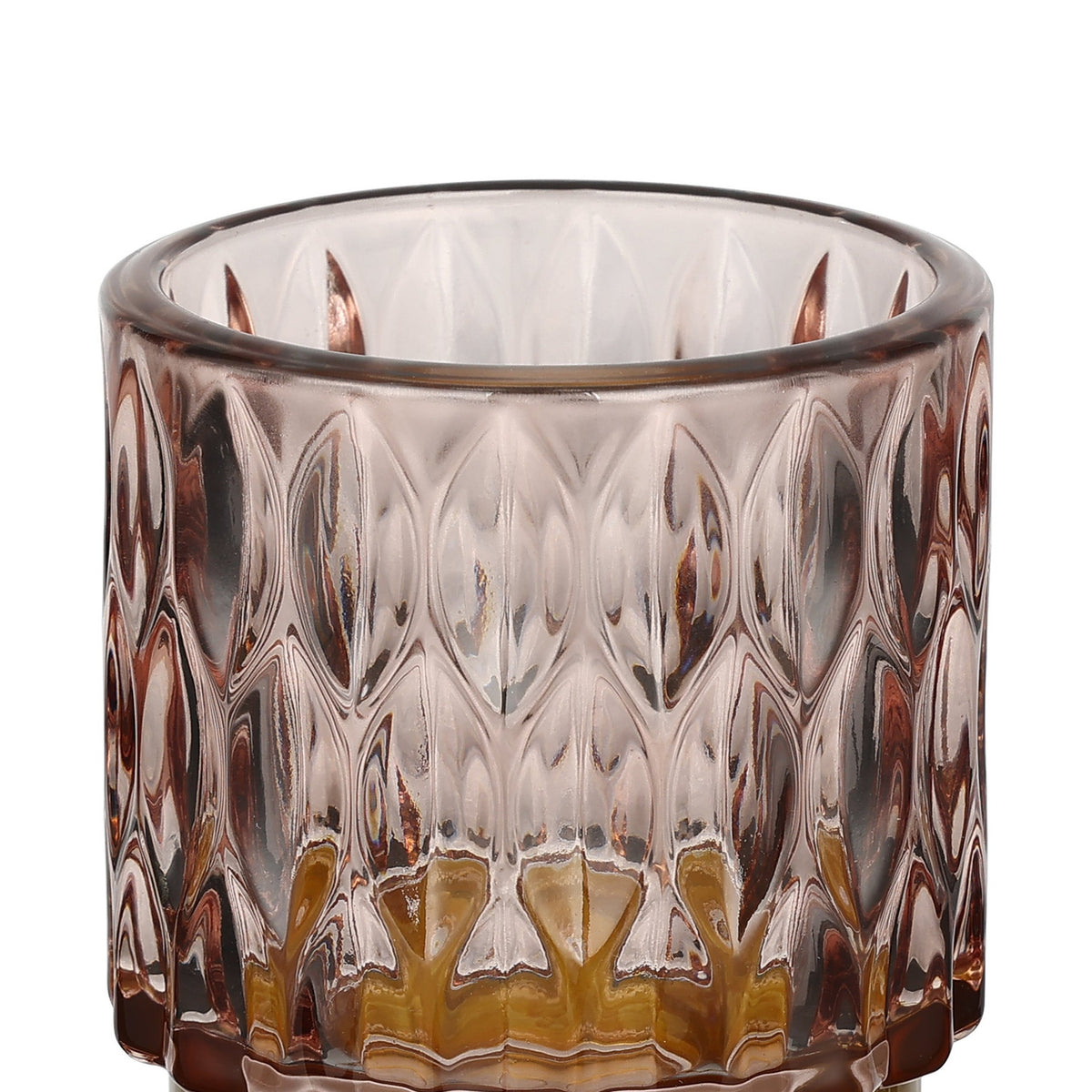Bezamby glass tealight holder in dusky pink, close-up of the faceted almond-pattern sides with an amber-toned glass base, shown against a plain white background.