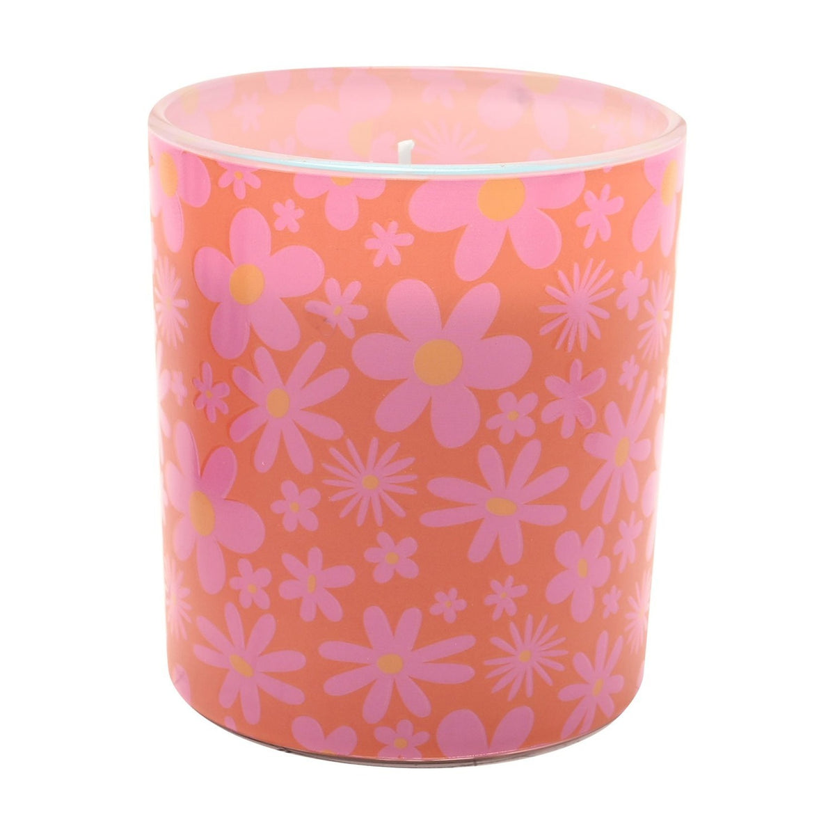 Super Duper Daisy Print Round Scented Candle in Pink, a round glass holder covered in pink daisy and starburst patterns on a coral ground, shown against a plain white background.