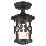 The Hereford-1 1 Light Outdoor Porch Lantern in black features a vintage-style design with traditional lantern elements, including decorative scrollwork and a clear cylindrical glass shade that beautifully displays a visible bulb. Ideal for outdoor use, this fixture exudes the timeless elegance of a classic porch light.