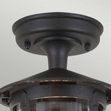 A close-up of the Hereford-1 1 Light Outdoor Porch Lantern in black features a traditional lantern design with a round base and short stem. The glass enclosure is crafted to hold a light bulb, making it the ideal choice for blending style with functionality as an outdoor porch light.