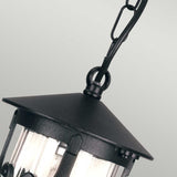 Close-up of the Hereford 1 Light Outdoor Porch Chain Pendant in black, featuring a conical top and clear glass panels, elegantly hanging from a chain link against a light gray background.