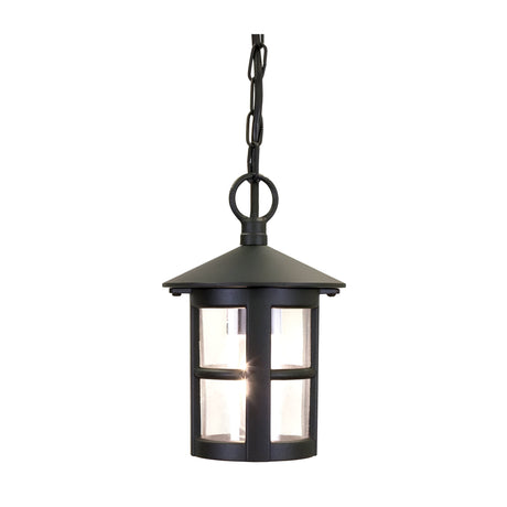 The Hereford 1 Light Outdoor Chain Pendant - Black is a lantern-style hanging fixture with a chain that features a circular flat top, clear glass panels, and showcases a single bulb inside. Its classic lantern design enhances both outdoor and indoor settings with its simple and timeless appeal.