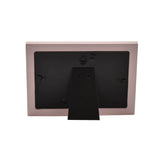 Back view of the Our Little Princess 6 x 4in pink MDF photo frame, showing a fold-out black stand and two wall-mount hooks on a white background.