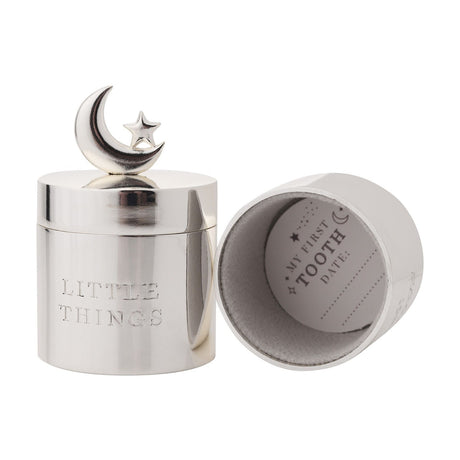Round silverplated metal keepsake box engraved "Little Things" with crescent moon and star finial, shown beside its open lid revealing a "My First Tooth" insert, on a white background.