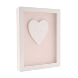1st Birthday Heart Framed Wooden Plaque, 17cm, with raised white heart on pink panel reading "on your first birthday" and "have a magical day", white frame, plain background.