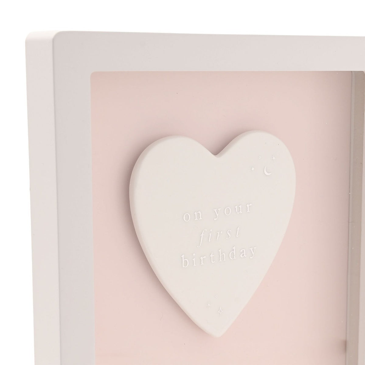 1st Birthday Heart Framed Wooden Plaque, close-up of a raised white heart with "on your first birthday" text and star details on a pink panel, white frame.
