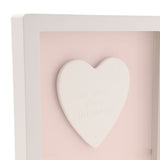 1st Birthday Heart Framed Wooden Plaque, close-up of a raised white heart with "on your first birthday" text and star details on a pink panel, white frame.