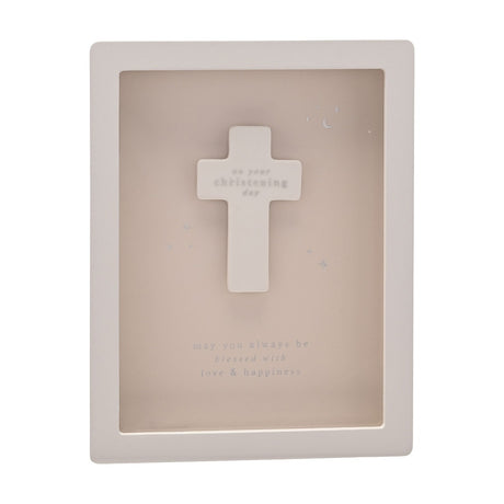 Wooden wall plaque with a raised white cross, reading on your christening day on a beige panel with star and moon details, white frame, and may you always be blessed with love & happiness below.