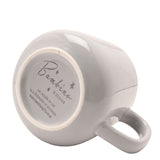 Underside view of the grey stoneware Grandad mug, showing the curved handle and base printed with the Bambino by Juliana logo and care instructions.
