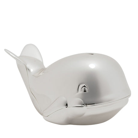 Silverplated whale-shaped money box with raised tail flukes, side fins, sculpted eyes, and a top coin slot, shown in a mirror-bright silver finish against a white background.