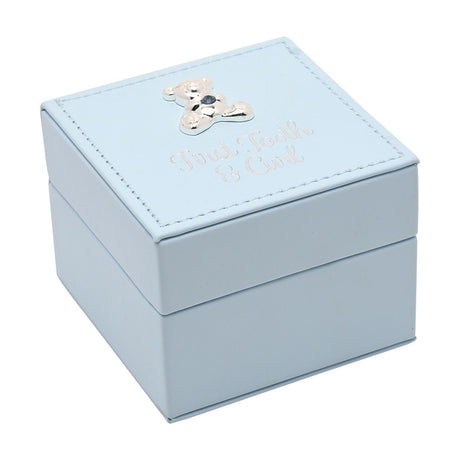 Square light blue plastic keepsake box with stitched lid border, silver-tone teddy bear and blue gem detail, foiled "First Tooth & Curl" script, on a white background.