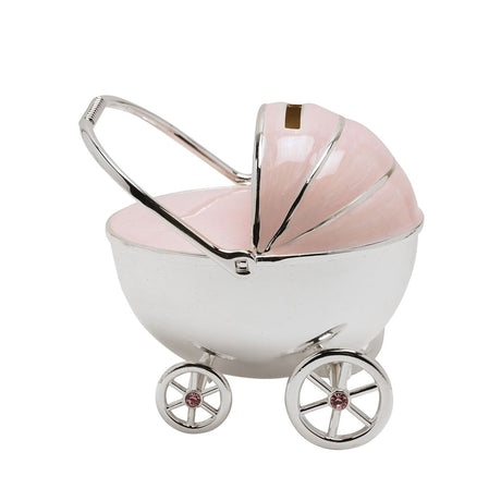 Silverplated pram-shaped money box with silver body and handle, pink ribbed hood with coin slot, and spoked wheels with pink gem centres on a white background.