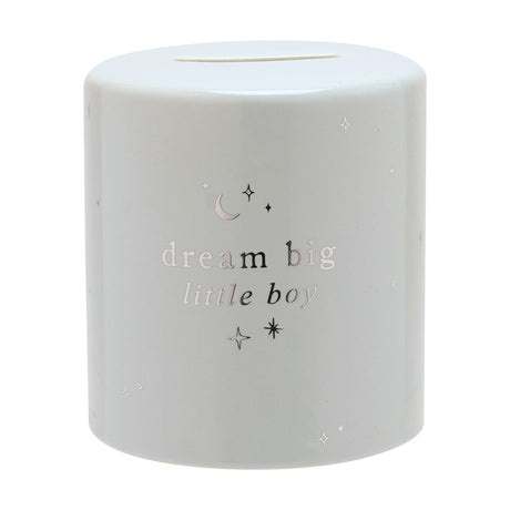 Round ceramic money box in light blue with glossy finish, featuring "dream big little boy" in silver foil text, moon and star details, and a top coin slot, shown on a plain white background.