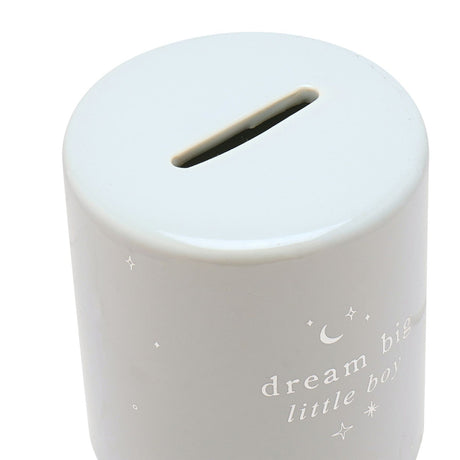 Close-up of the Little Boy Round Ceramic Money Box in light blue with a glossy finish, showing the coin slot on top and "dream big little boy" text with moon and star details on the side.