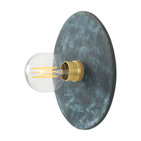 Bog Oak Ceramic Disc Wall Light in Blue Earth, a round mottled blue ceramic disc with brass lampholder and bare E27 bulb, shown on a white background.