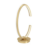 Bogado LED Table Lamp in gold-coloured steel, shaped as an open C-ring with a white diffuser line on a round disc base, shown on a plain white background.