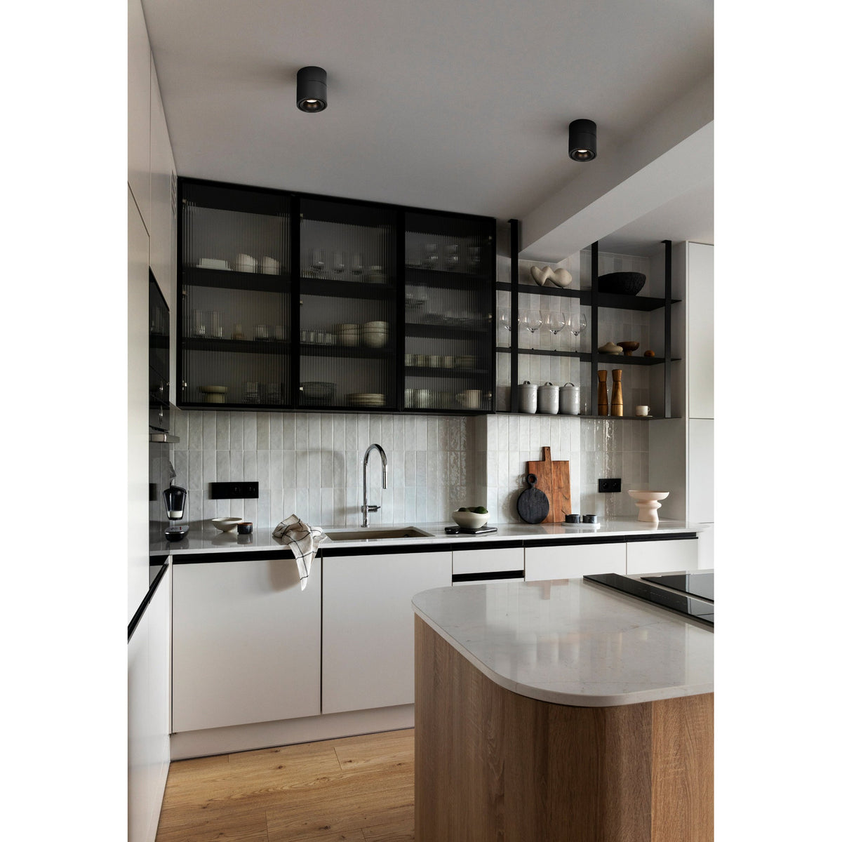 Bohoyo LED Downlight in black, compact cylindrical ceiling fixture shown surface-mounted in a kitchen with pendant-style housing and integrated warm white LED.