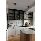 Bohoyo LED Downlight in black, compact cylindrical ceiling fixture shown surface-mounted in a kitchen with pendant-style housing and integrated warm white LED.