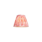 Endon Brenwell 16cm tapered lamp shade in coral pink and white ikat printed faux silk with gathered pleats and taped edges, on a white background.