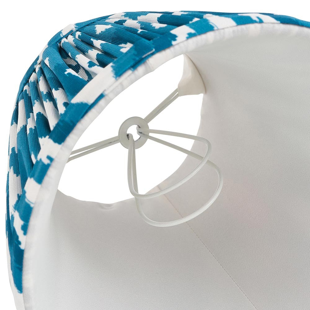 Interior view of Endon Brenwell 16cm tapered lamp shade in marlin blue ikat faux silk, showing white inner lining, candle clip fitting and gimbal.