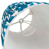 Interior view of Endon Brenwell 16cm tapered lamp shade in marlin blue ikat faux silk, showing white inner lining, candle clip fitting and gimbal.
