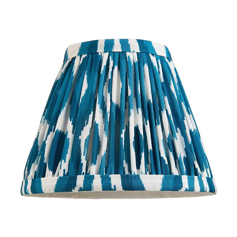 Endon Brenwell 16cm tapered lamp shade in marlin blue and white ikat printed faux silk with gathered pleats and taped edges, on a white background.