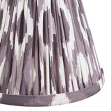 Endon Brenwell 16cm tapered lamp shade in pearl grey pleated faux silk with ikat print and taped edge trim, shown close up on a white background.
