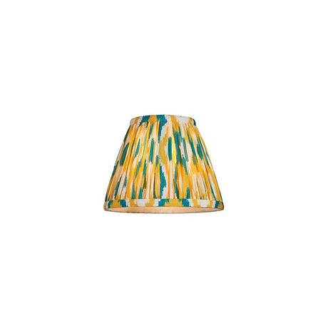 Endon Brenwell 16cm tapered lamp shade in pleated faux silk with a yellow and jade ikat print and taped edges, on a white background.