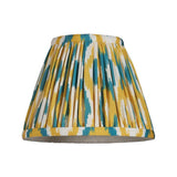 Endon Brenwell 16cm tapered lamp shade in pleated faux silk with yellow and jade ikat print and taped edges, shown on a plain white background.
