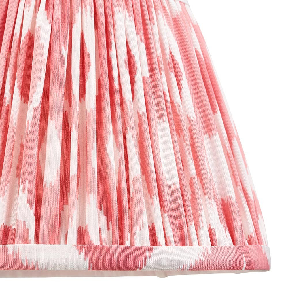 Endon Brenwell 20cm tapered lamp shade in coral pink and white, shown close-up with gathered pleated faux silk, ikat print and taped edge trim.