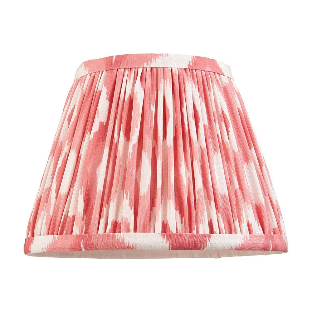 Endon Brenwell 20cm tapered lamp shade in coral pink and white ikat printed faux silk with gathered pleats and taped edging, on a white background.