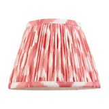 Endon Brenwell 20cm tapered lamp shade in coral pink and white ikat printed faux silk with gathered pleats and taped edging, on a white background.