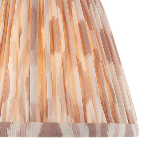 Close-up of Endon Brenwell 20cm tapered lamp shade in neutral, showing pleated faux silk with a soft ikat print in cream and warm beige tones.