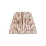Endon Brenwell 20cm tapered lamp shade in pleated faux silk with a neutral and white ikat print and taped edges, on a plain white background.