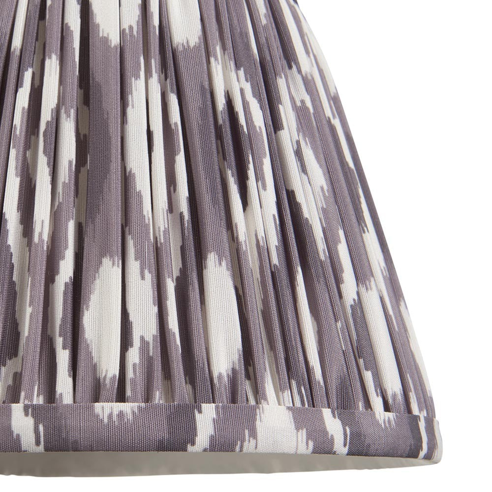 Close-up of Endon Brenwell 20cm tapered lamp shade in pearl grey, showing gathered pleated faux silk with a grey and white ikat print.