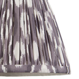 Close-up of Endon Brenwell 20cm tapered lamp shade in pearl grey, showing gathered pleated faux silk with a grey and white ikat print.