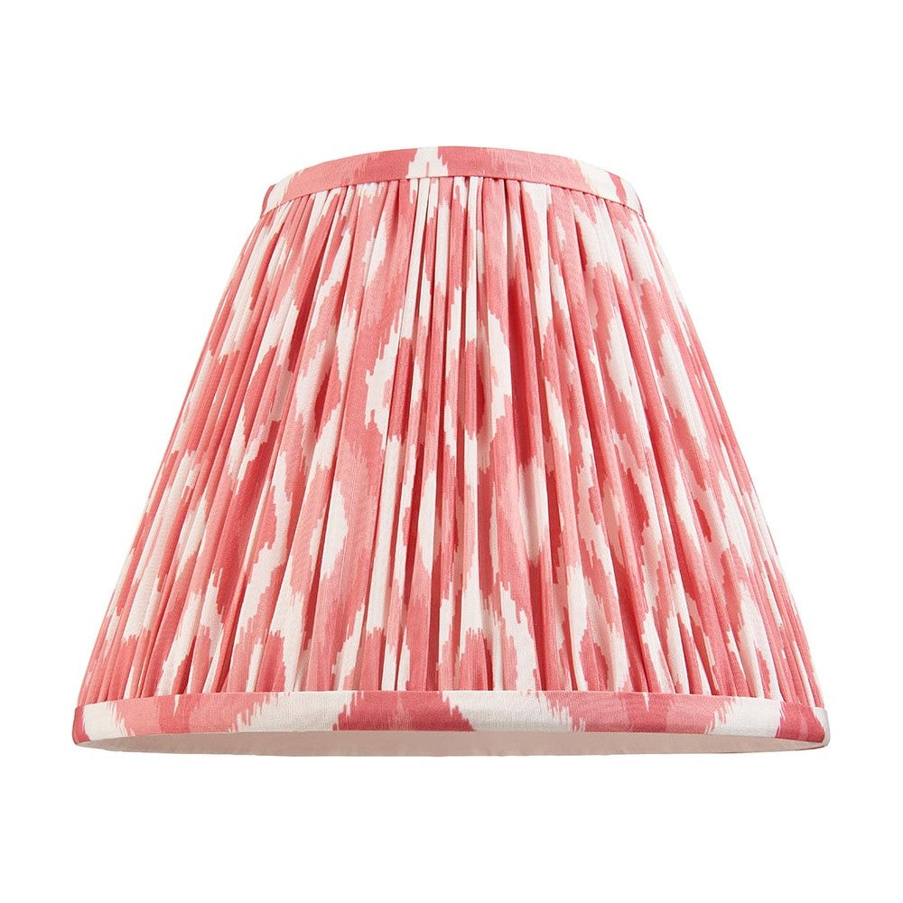 Endon Brenwell 25cm tapered lamp shade in coral pink and white ikat print on pleated faux silk with taped edges, shown on a plain background.