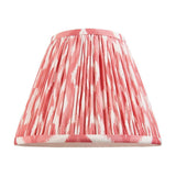 Endon Brenwell 25cm tapered lamp shade in coral pink and white ikat print on pleated faux silk with taped edges, shown on a plain background.