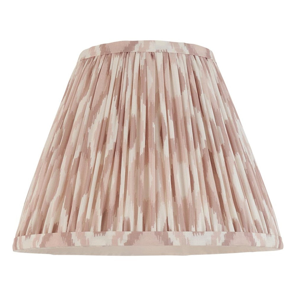 Endon Brenwell 25cm tapered lamp shade in pleated faux silk with a neutral pink and cream ikat print and taped edges, on a plain white background.