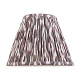 Endon Brenwell 25cm tapered lamp shade in pearl grey pleated faux silk with an ikat pattern and taped edges, shown on a plain white background.