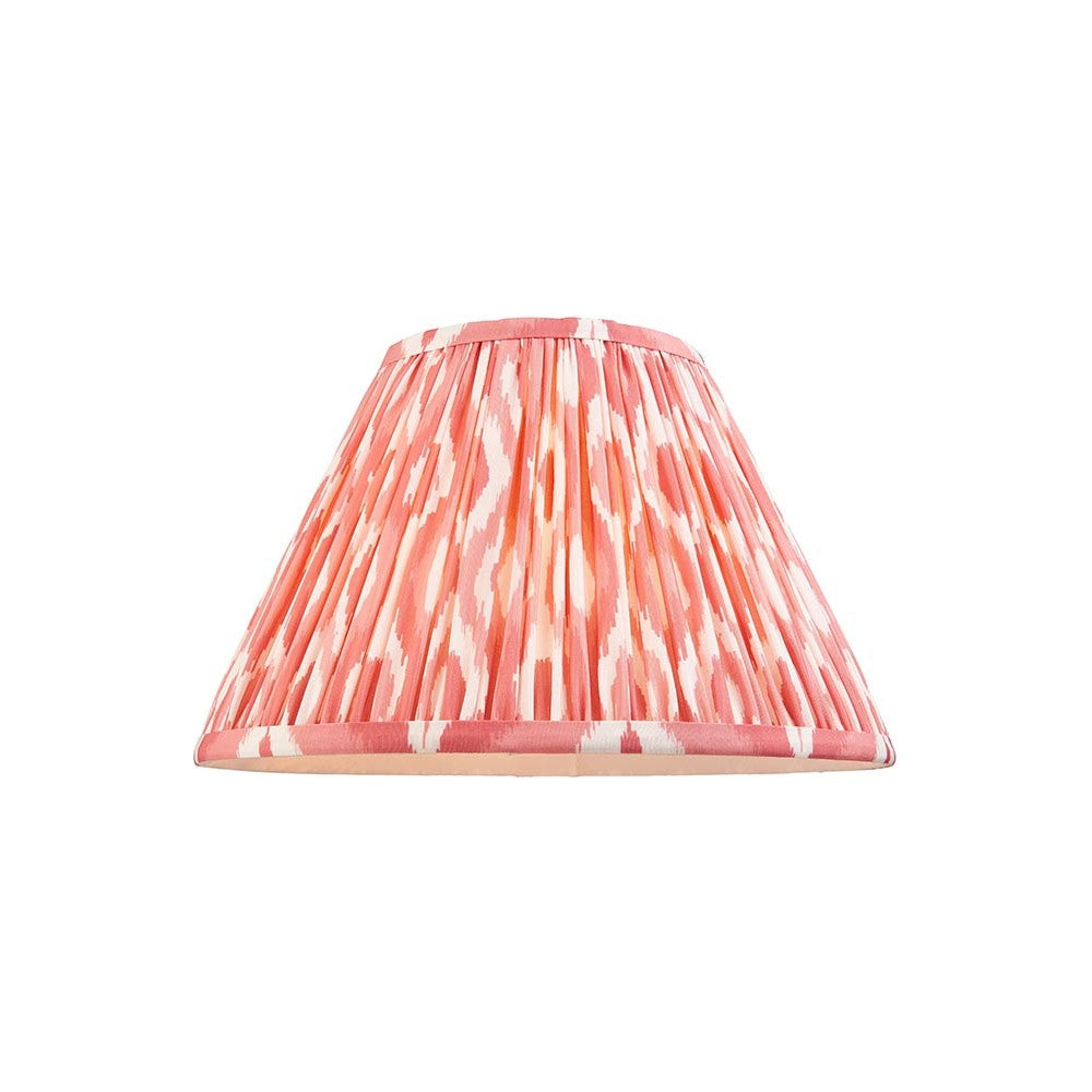 Endon Brenwell 30cm tapered lamp shade in pleated faux silk with coral pink and white ikat print and taped edging, shown on a plain white background.